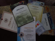 Различные грамоты конференций, удостоверение ведомственной медали Роскосмоса